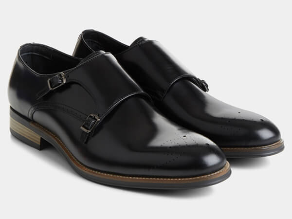Black monk shoes with broguing from Moss Bros
